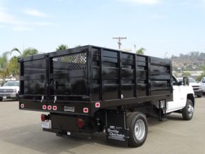 White Chevrolet work truck outfitted for landscaping