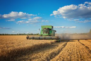 Farmer uses combine and air compressors to get the job done